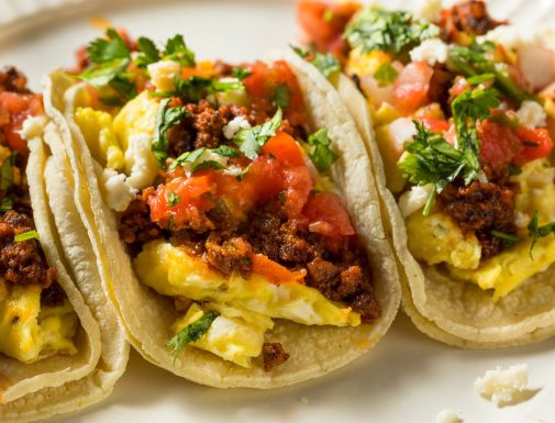 beef chorizo breakfast tacos with eggs, salsa, cilantro, and cheese